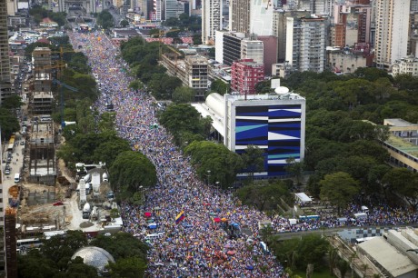 General view shows street filled with supporters of Venezuela's opposition presidential candidate Capriles during a regional closing campaign rally in Caracas capriles aereo e1349238491190