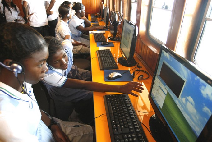 Colombian students learn how to use computers in the ship 'El Navegante del Pacifico' in the port city of Tumaco