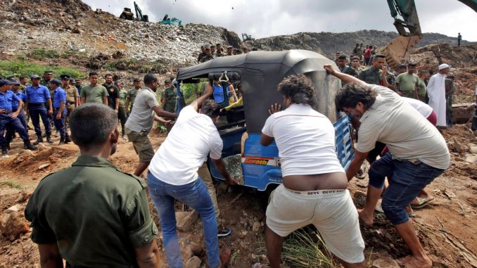 Garbage mountain collapses, buries 40 houses and kills 10