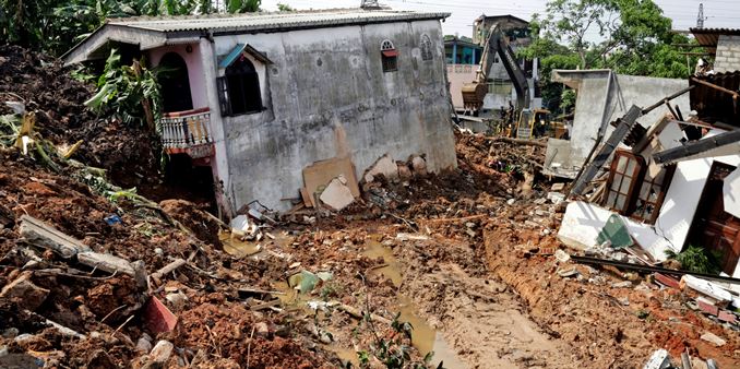 Garbage mountain collapses, buries 40 houses and kills 10