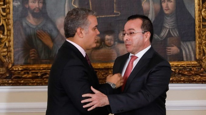 El presidente Iván Duque y el director del SENA, Carlos Mario Estrada.