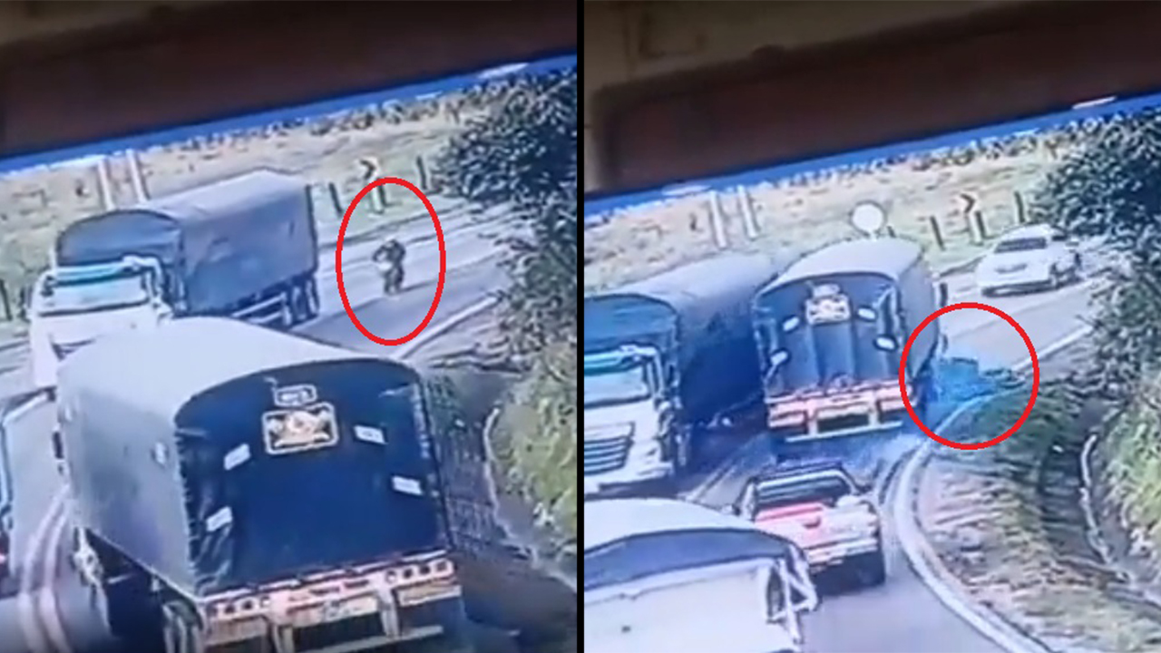 ¡Muerto, pero del susto! Motociclista imprudente casi es atropellado en una curva por una tractomula