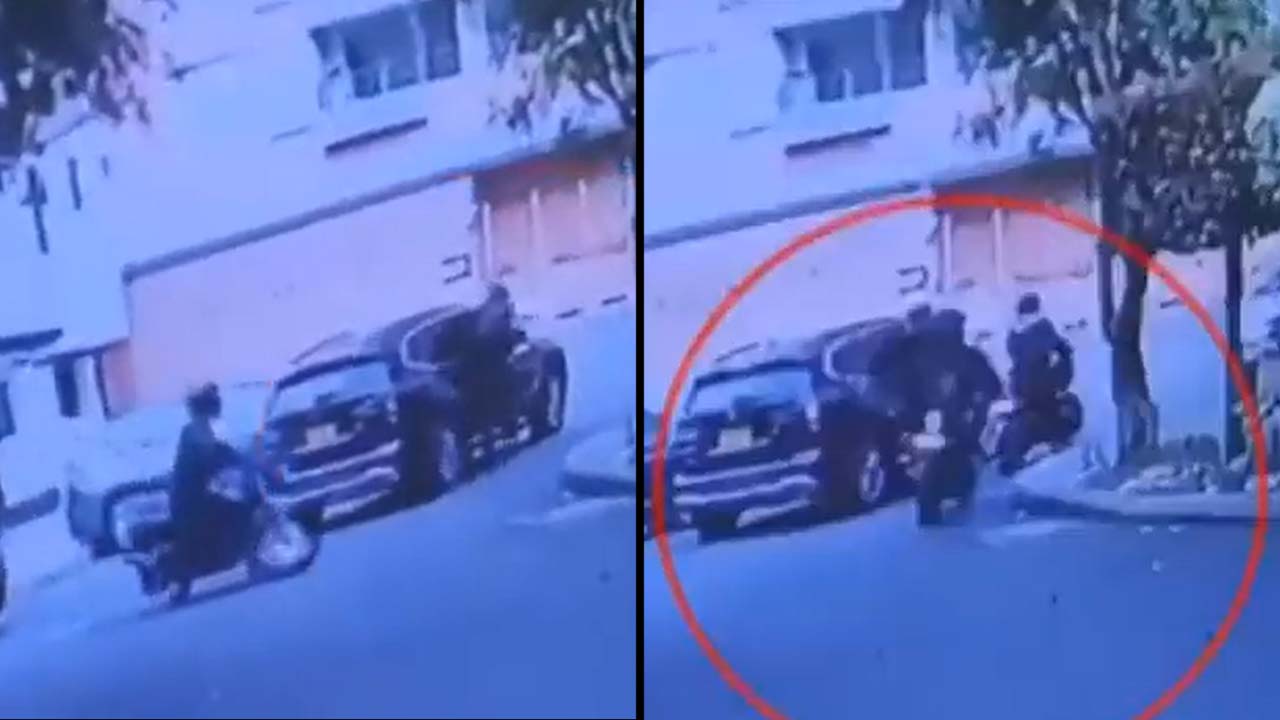 Video. %C2%A1Vivito y colgando En Bogota conductor arrastro a ladron que le iba a robar