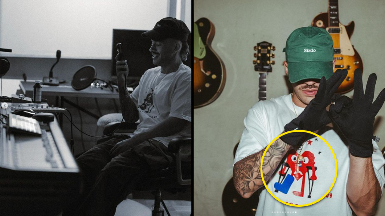 Feid collar con imagen espada refencia tatutaje Karol G