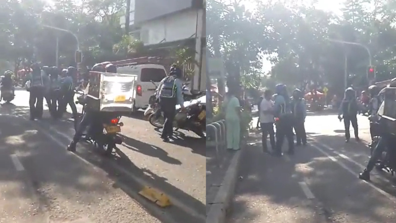 VIDEO. Agente de tránsito y operador de grúa heridos por un motociclista  en Bello