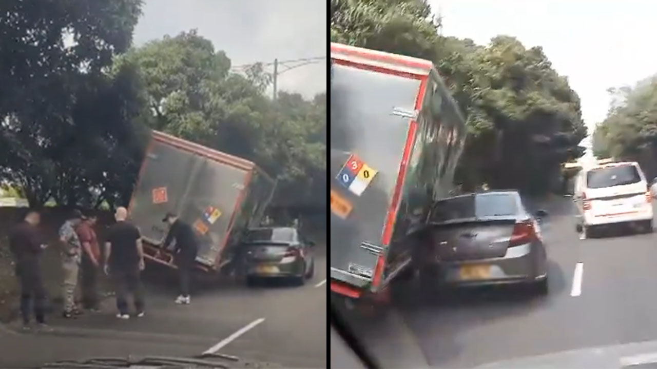 Camión se subió a separador de la Autopista sur